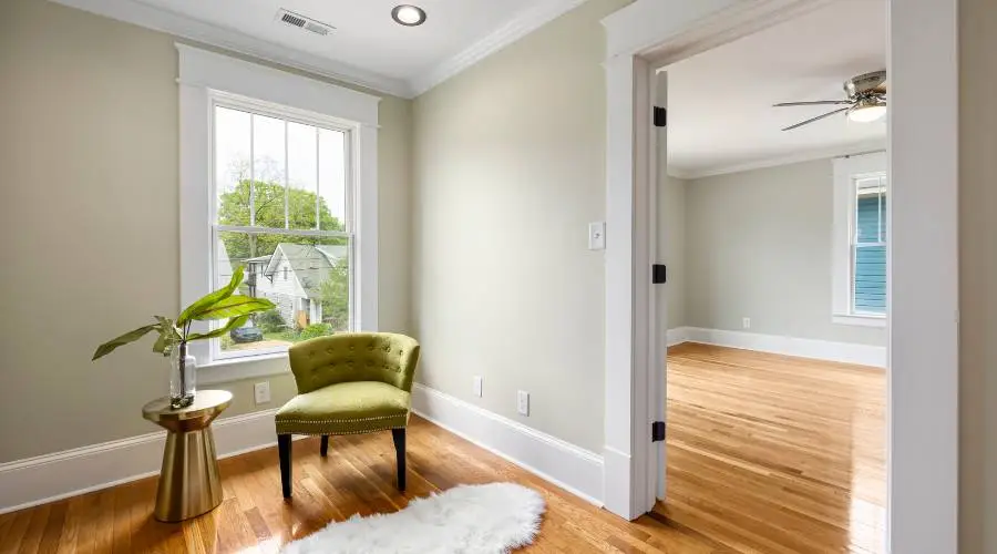 Bright room with chair and hardwood floor