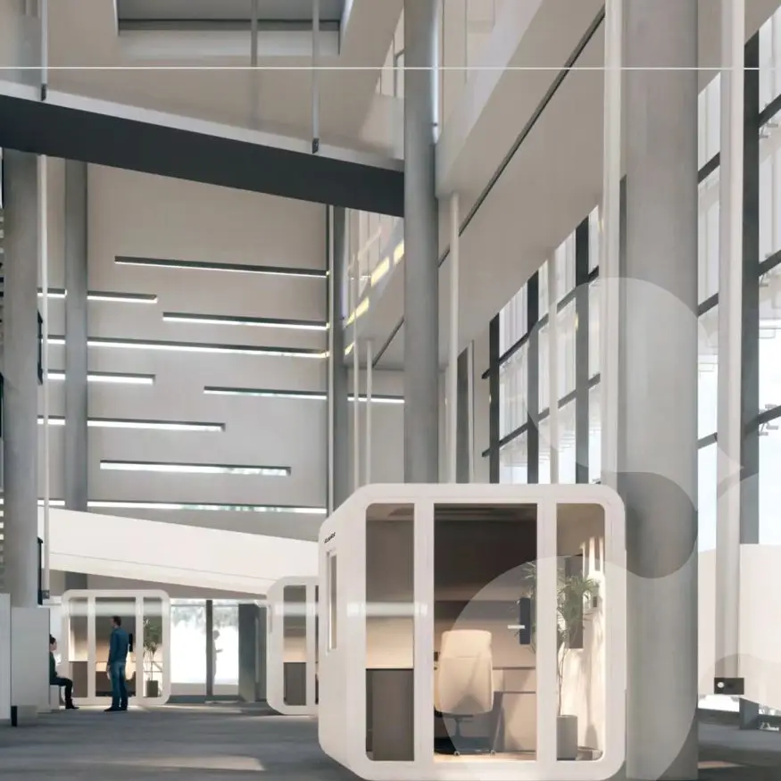 Modern office interior with glass cubicles and natural light.