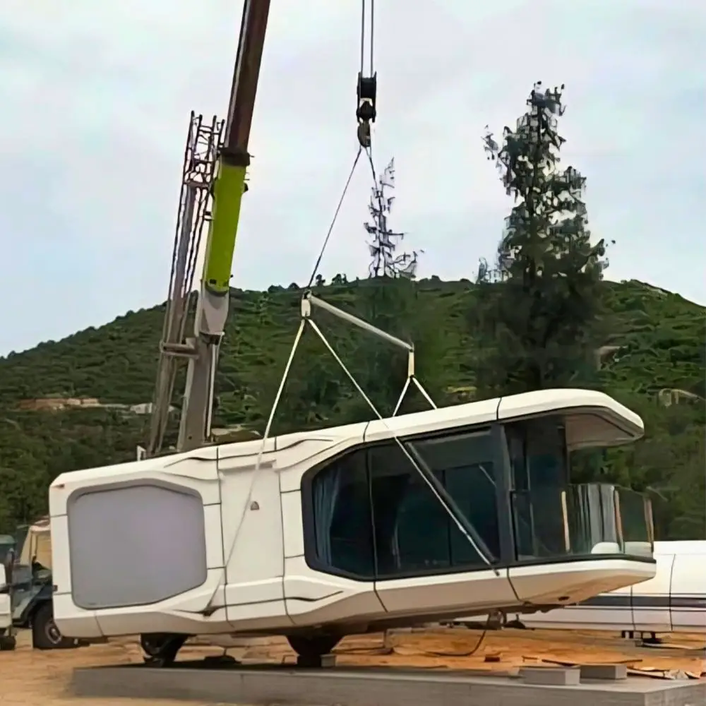 Crane lifting modern prefabricated house